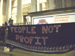 A protest banner outside the event at the Manchester Art Gallery