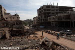 A View on a street and surrounding buildings devastated by an Israeli military airstrike which occurred on 14 November in the neighborhood of Tal el Hawa, city of Gaza, seen on November 16, 2012. Photograph: Anne Paq/Activestills